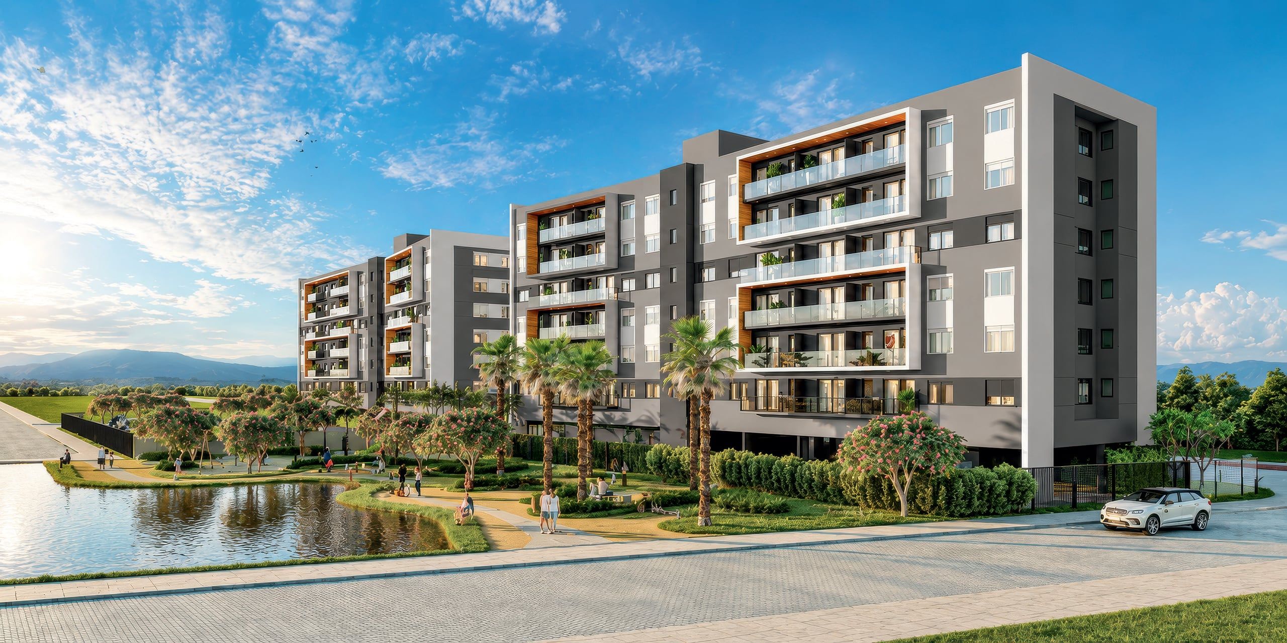 Edifícios residenciais do Santorini, em Xangri-lá, com lago e palmeiras